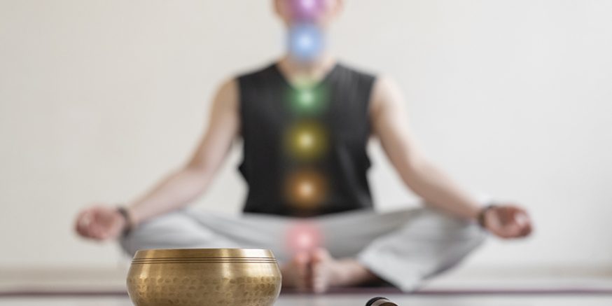 spiritual-young-man-practicing-yoga-indoors